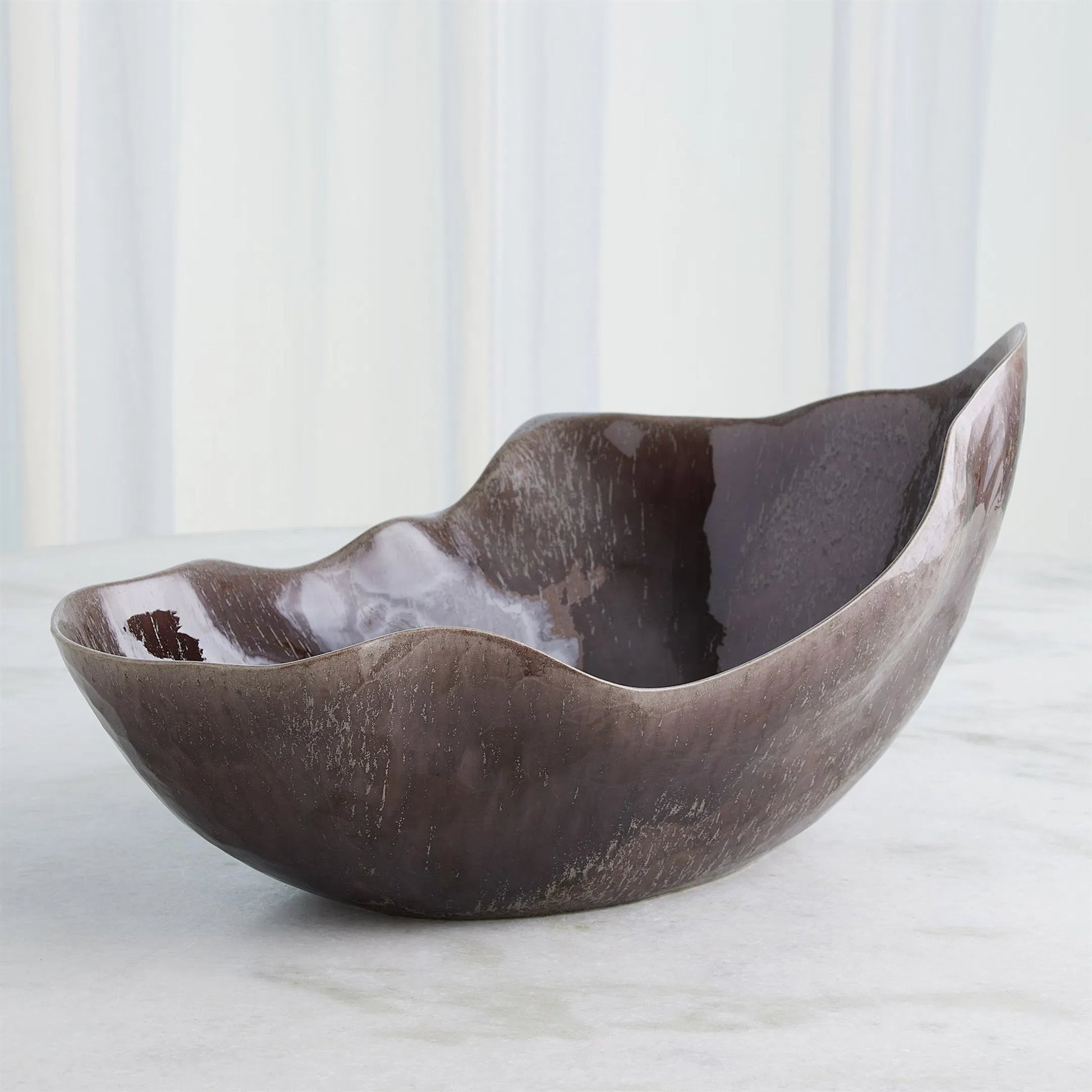 Horn Bowl, Reactive Amethyst by Global Views in reactive amethyst. Made from ceramic in a modern style.