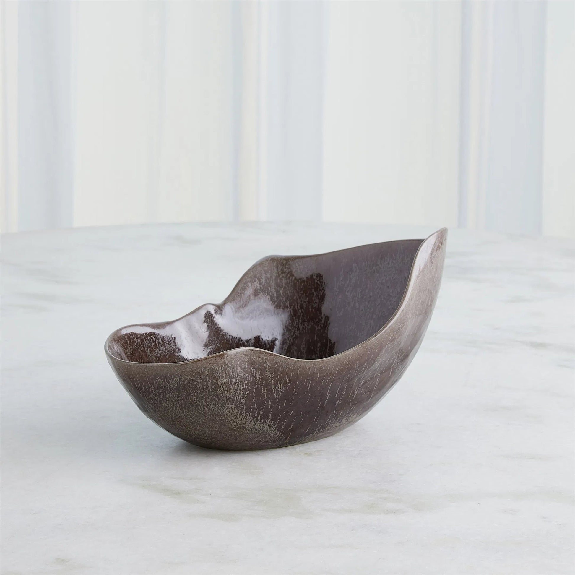 Horn Bowl, Reactive Amethyst by Global Views in reactive amethyst. Made from ceramic in a modern style.
