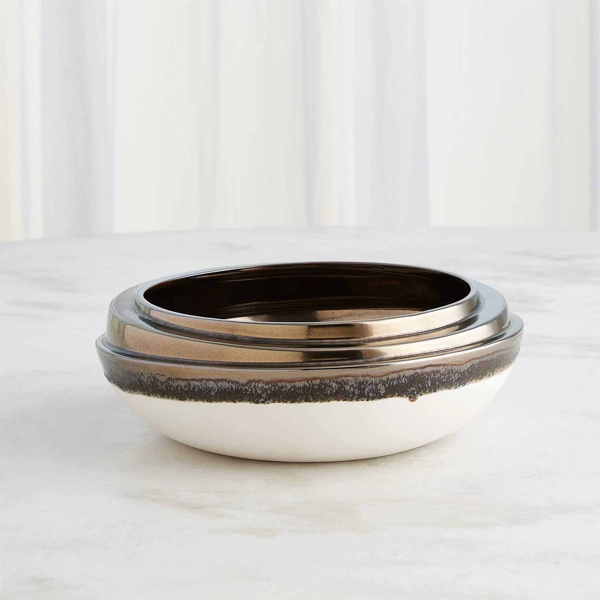Slant Stack Bowl by Global Views in reactive bronze. Made from earthenware (ceramic) in a modern style.