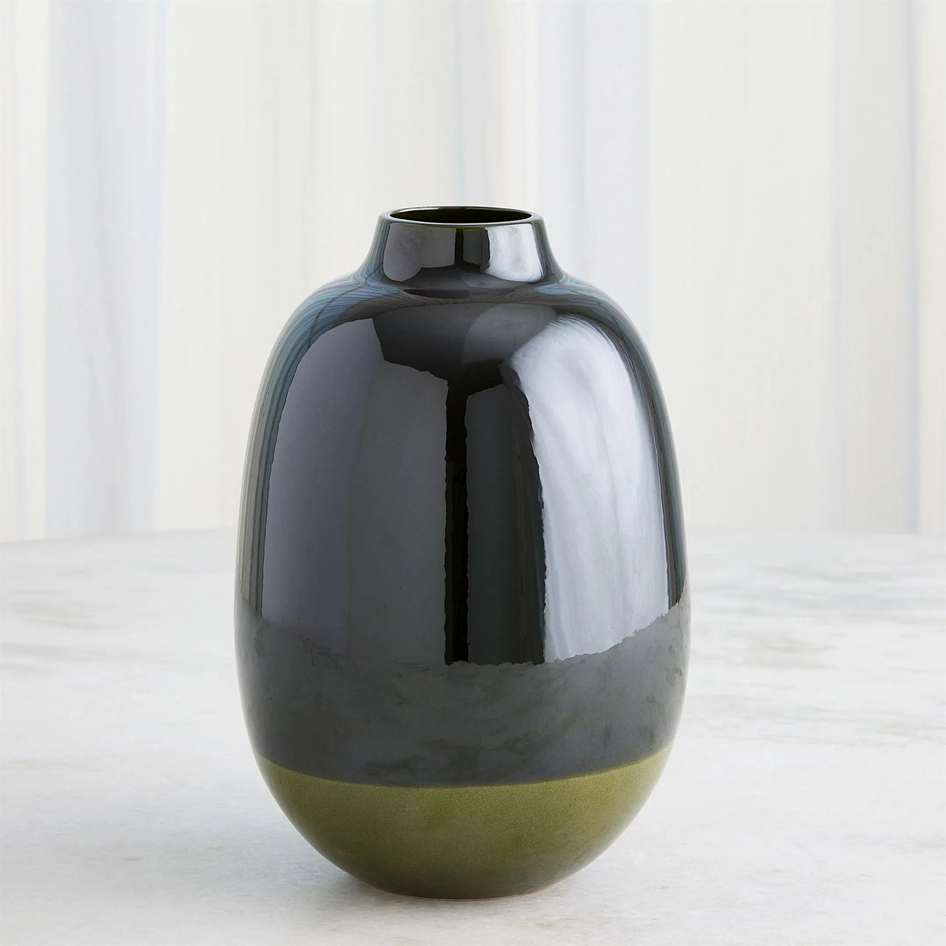 Tidal Vase by Global Views. Made from earthenware in a transitional style.