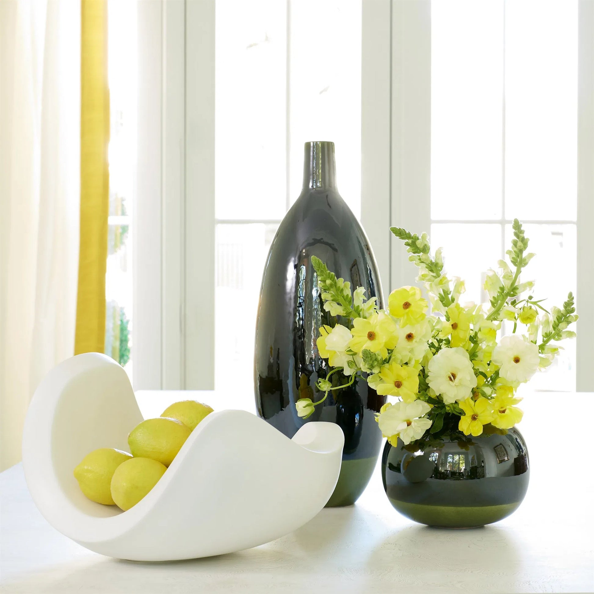 Curl Bowl by Global Views in matte white. Made from ceramic in a modern style.