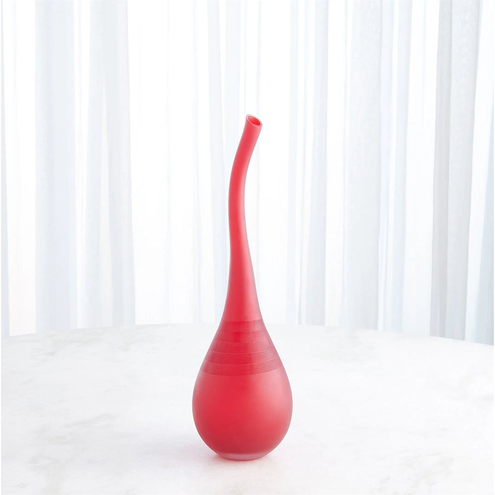 Curvature Bottle by Global Views. Made from art glass in a eclectic & global style.