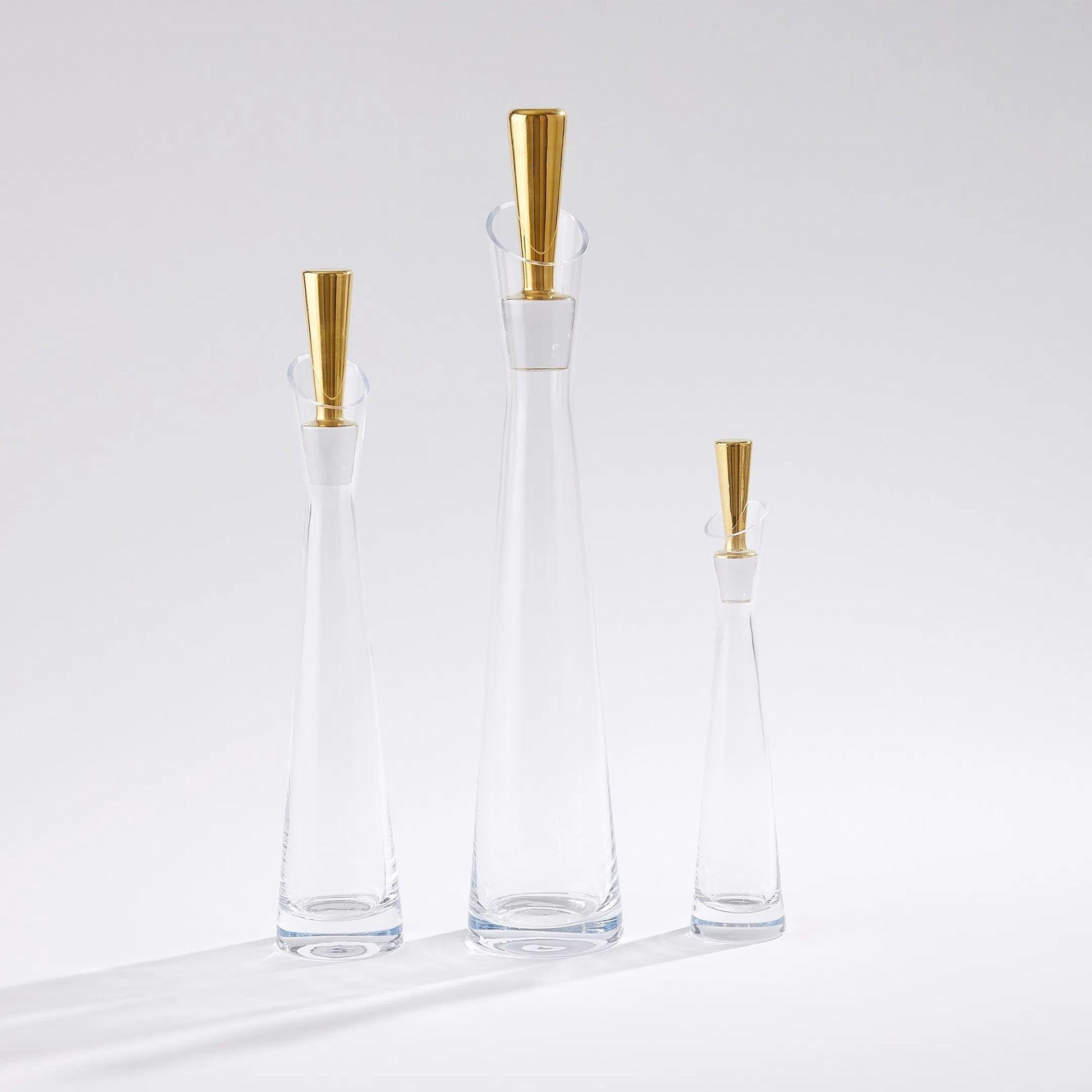Slant Decanter by Global Views. Made from glass in a transitional style.