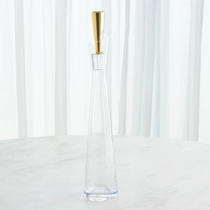 Slant Decanter by Global Views. Made from glass in a transitional style.