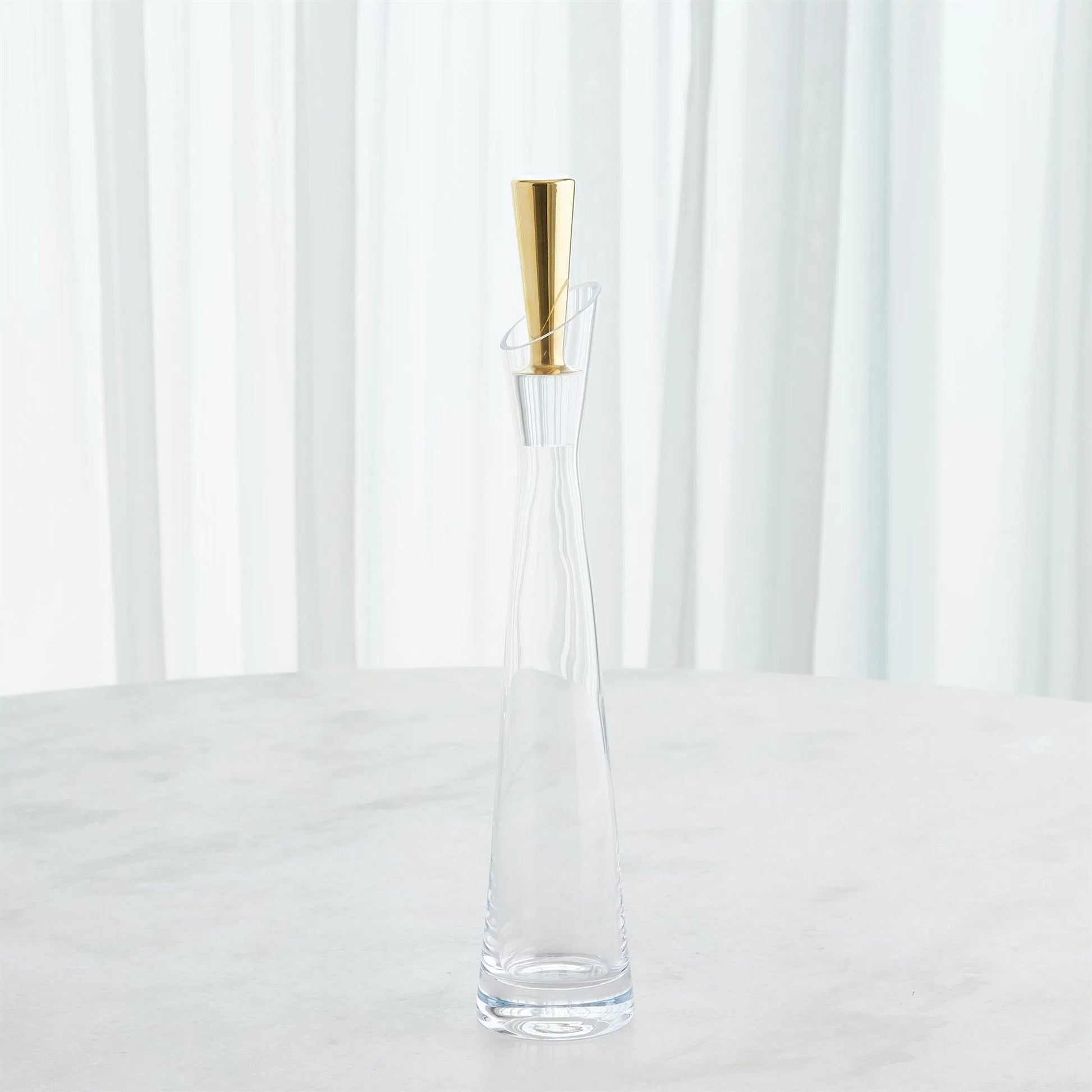 Slant Decanter by Global Views. Made from glass in a transitional style.