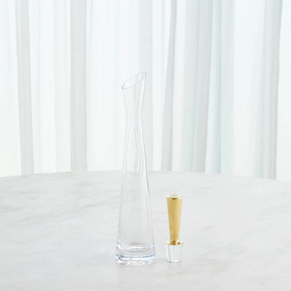 Slant Decanter by Global Views. Made from glass in a transitional style.