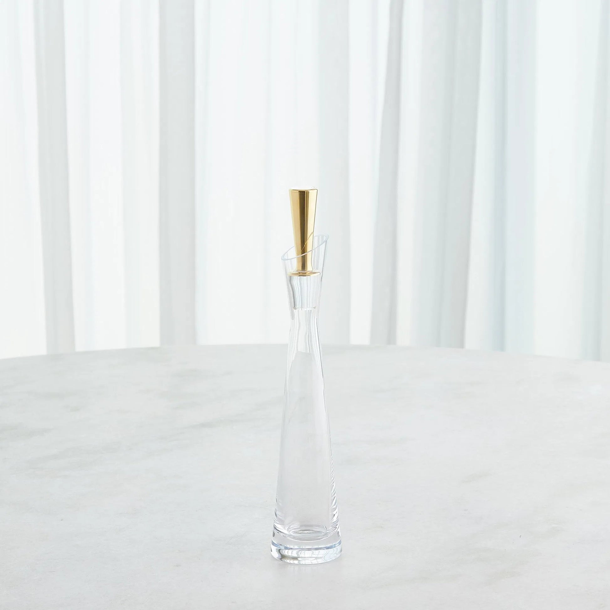 Slant Decanter by Global Views. Made from glass in a transitional style.