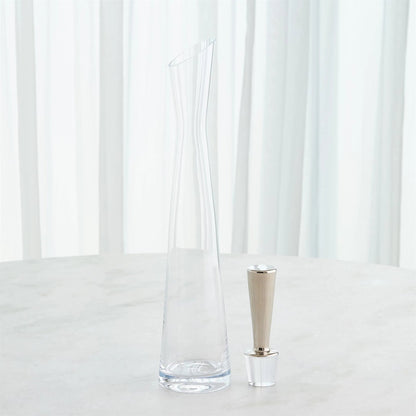 Slant Decanter by Global Views. Made from glass in a transitional style.