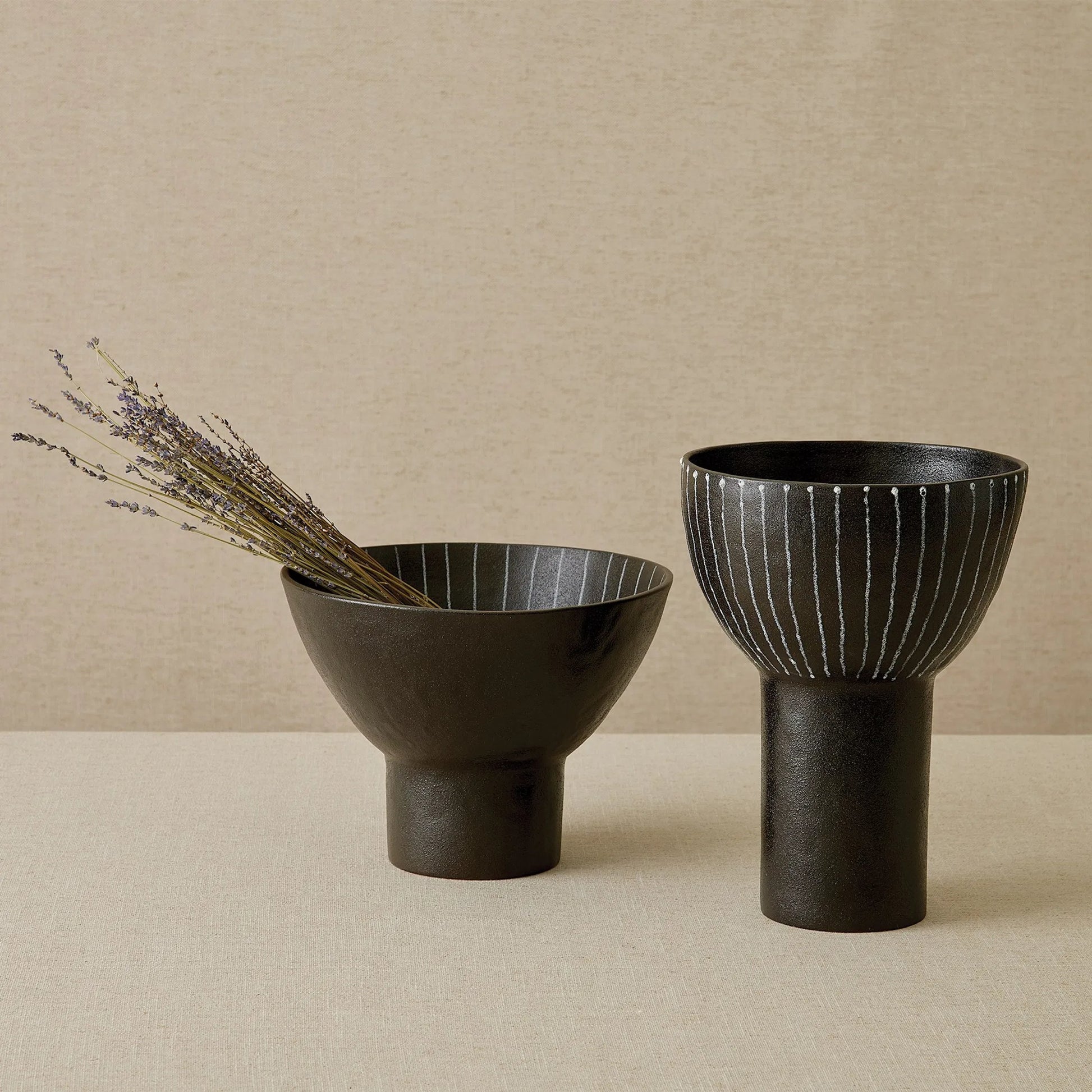 Cinder Footed Bowl I by Global Views in striped. Made from stoneware in a rustic style.
