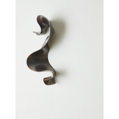 Tempest Wall Ribbon by Global Views. Made from ceramic in a modern style.