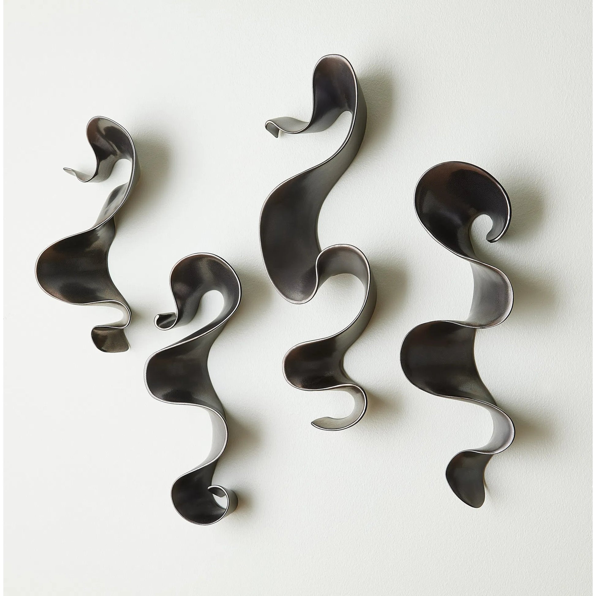 Tempest Wall Ribbon by Global Views. Made from ceramic in a modern style.