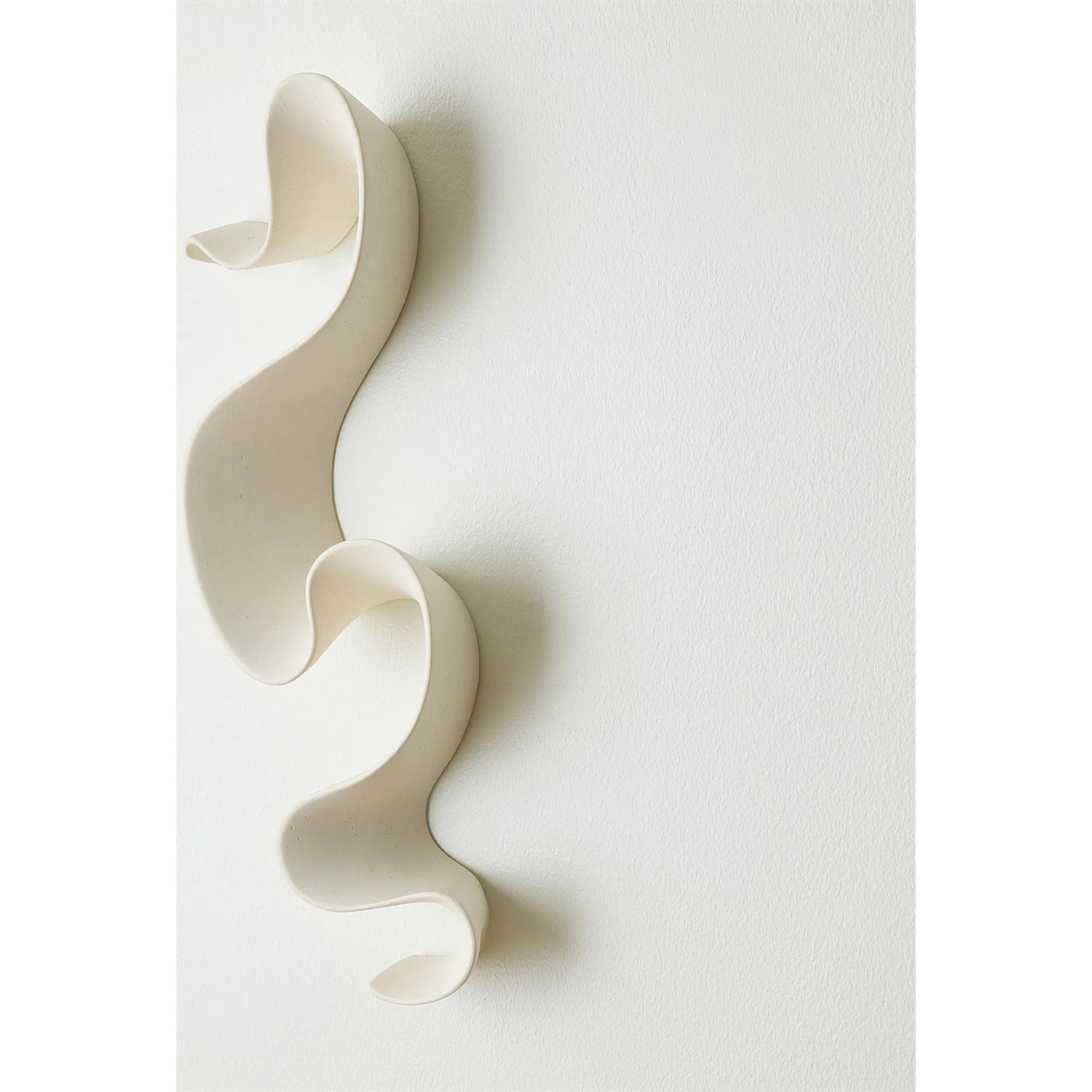 Tempest Wall Ribbon by Global Views. Made from ceramic in a modern style.