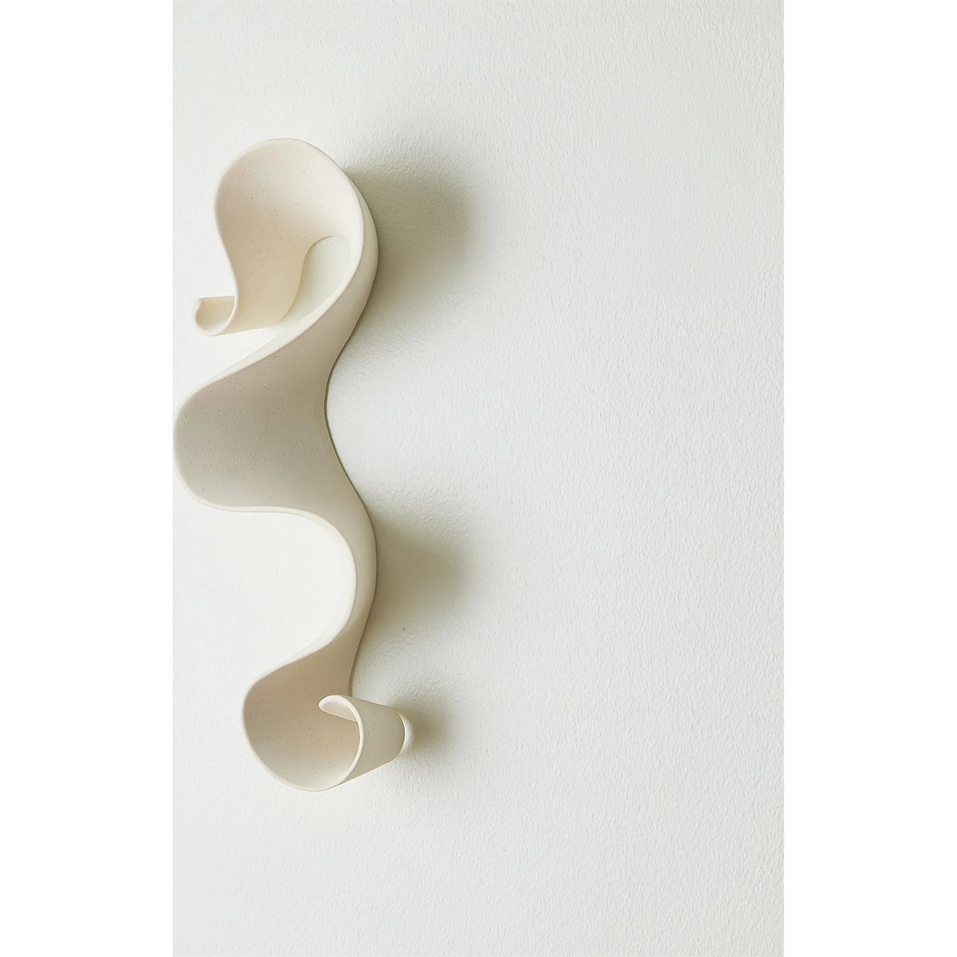 Tempest Wall Ribbon by Global Views. Made from ceramic in a modern style.