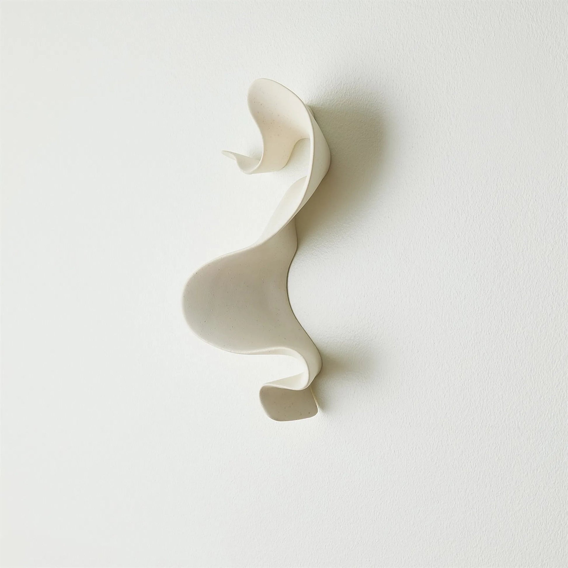 Tempest Wall Ribbon by Global Views. Made from ceramic in a modern style.