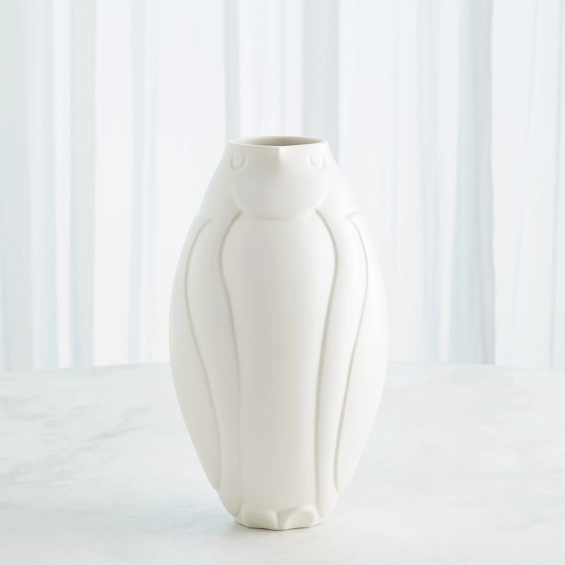 Penguin Vase by Global Views. Made from ceramic in a modern style.