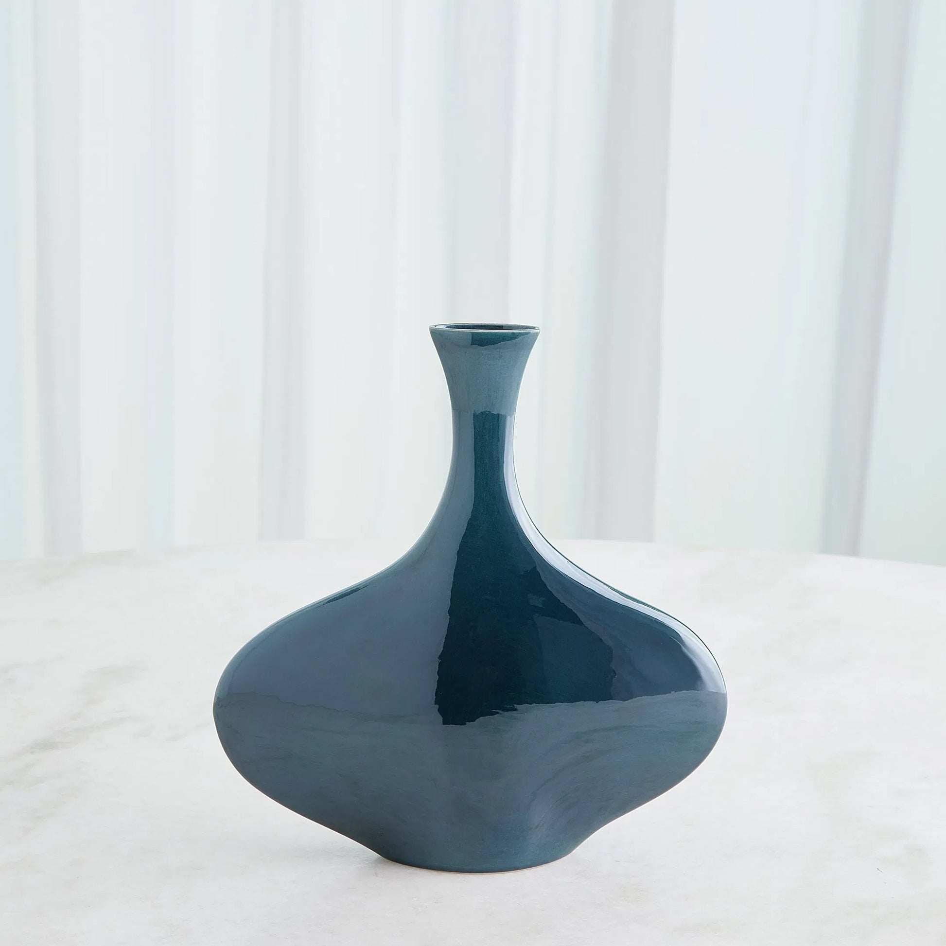 Silhouette Vase by Global Views. Made from ceramic in a modern style.