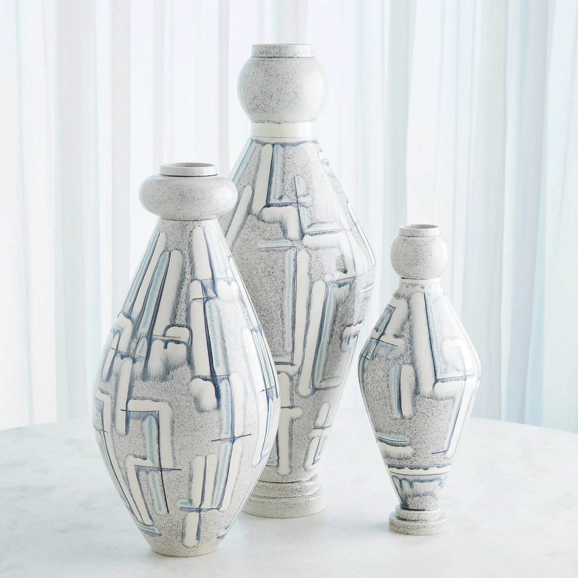 Spindle Vase by Global Views in grey, blue painted. Made from ceramic in a unique style.