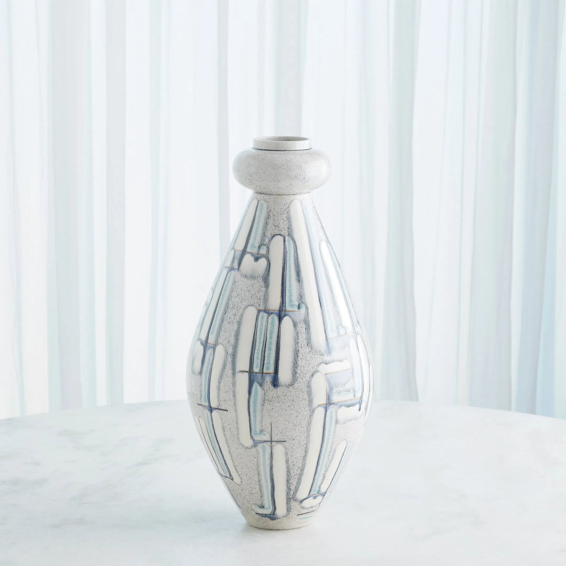 Spindle Vase by Global Views in grey, blue painted. Made from ceramic in a unique style.