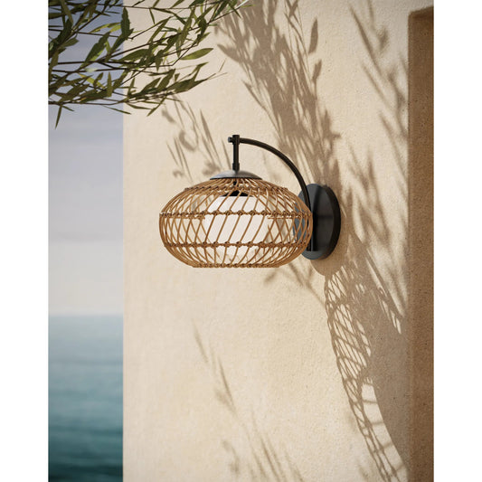Carriage Outdoor Wall Sconce by Currey and Company in natural, black, frosted white. Made from all-weather wicker, metal, glass in a rustic style.