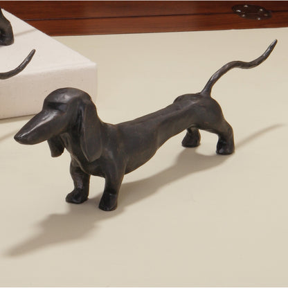 Dachshund Hound Sculpture by Global Views in bronze. Made from cast iron in a eclectic & global style.