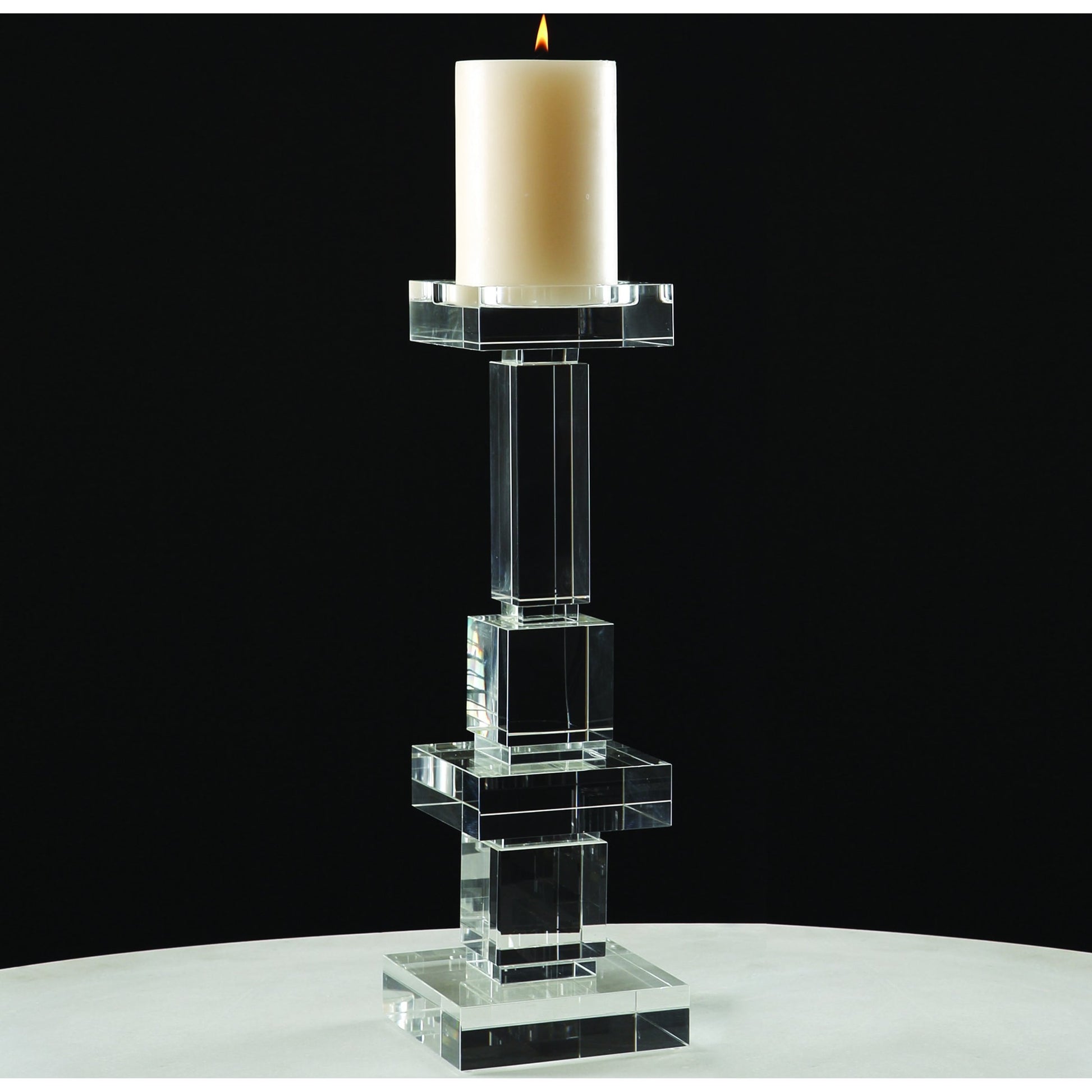 Brilliant Pillar Candle Holder by Global Views. Made from crystal in a transitional style.