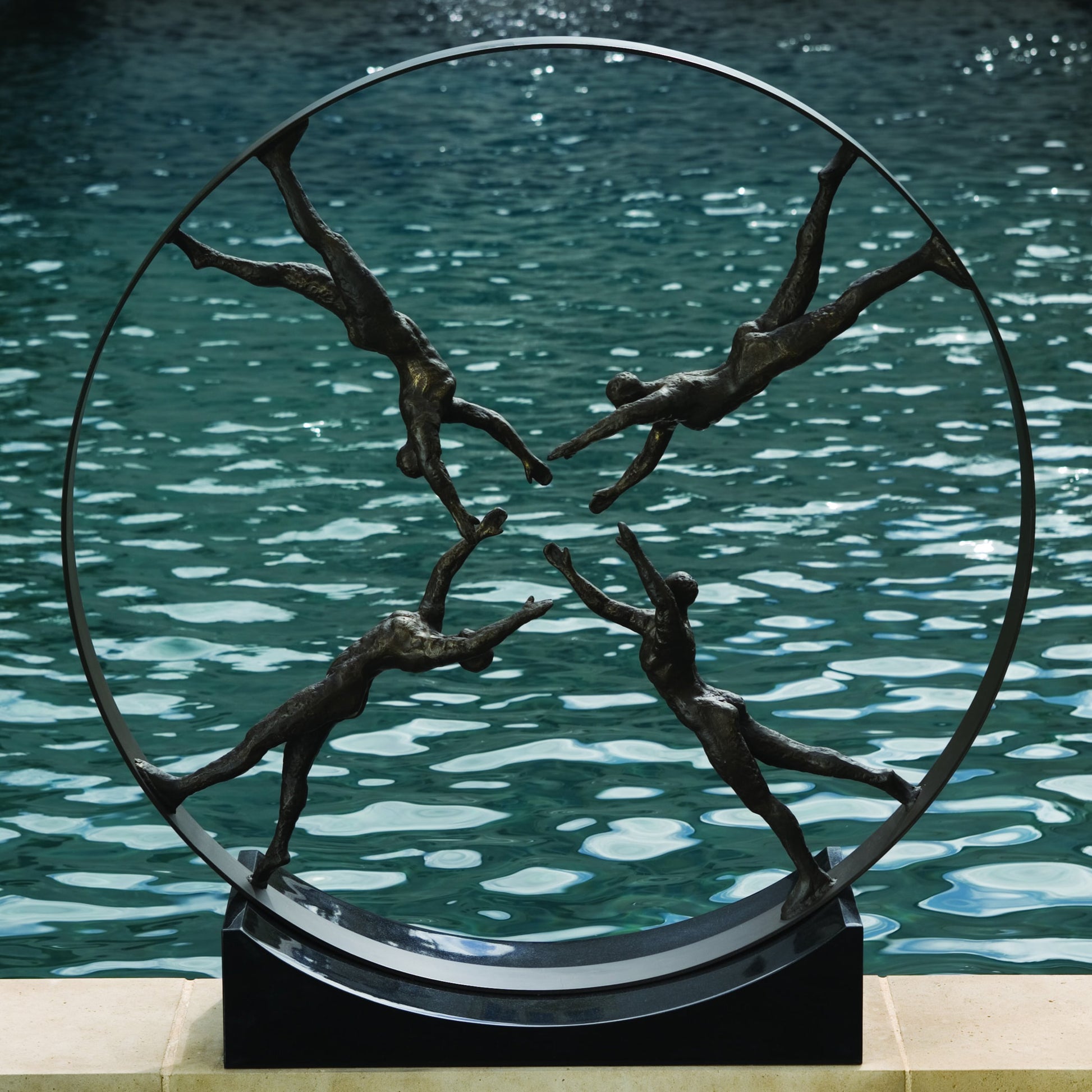 Reaching for Center Sculpture by Global Views. Made from iron, granite in a eclectic & global style.