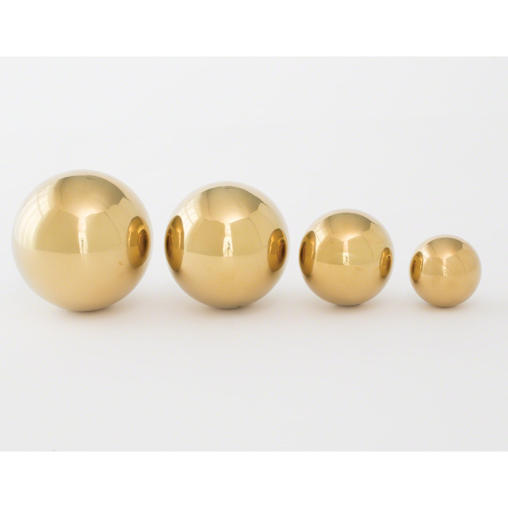 Brass Ball by Global Views. Made from iron in a transitional style.