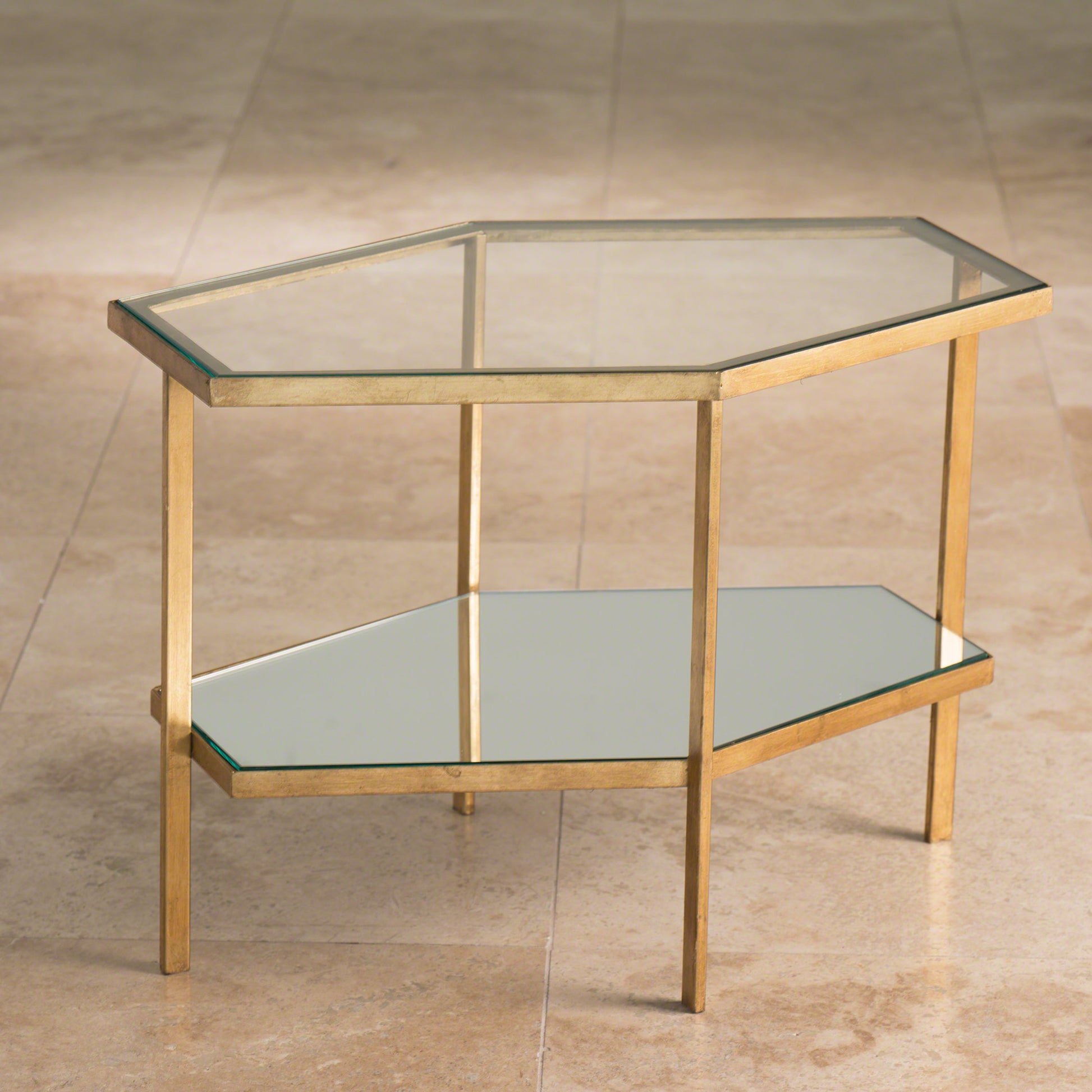 Hexagon Table by Global Views in gold leaf. Made from unique in a transitional style.