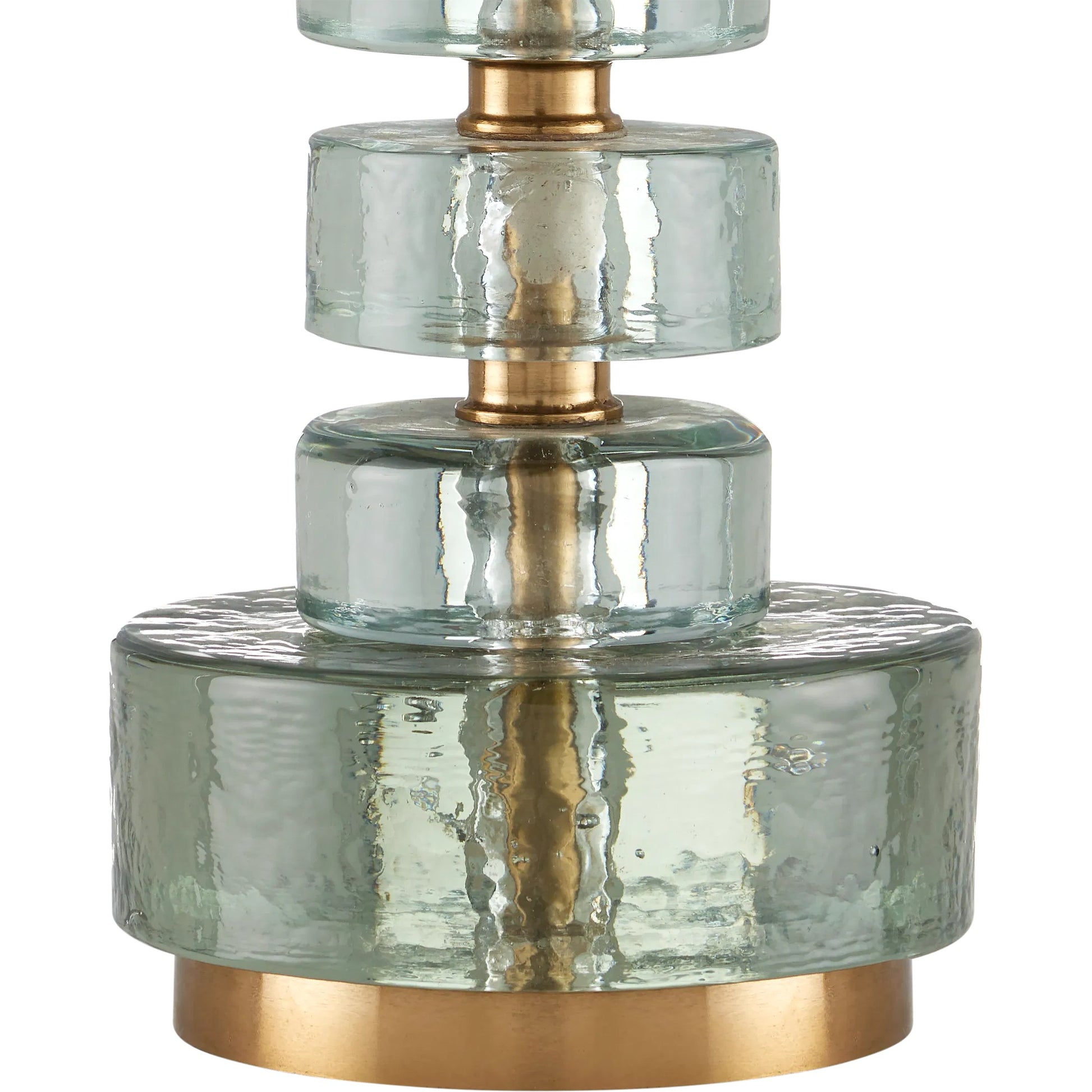Mystras Table Lamp by Currey and Company in clear, antique brass. Made from cast glass, iron in a modern style.