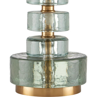 Mystras Table Lamp by Currey and Company in clear, antique brass. Made from cast glass, iron in a modern style.
