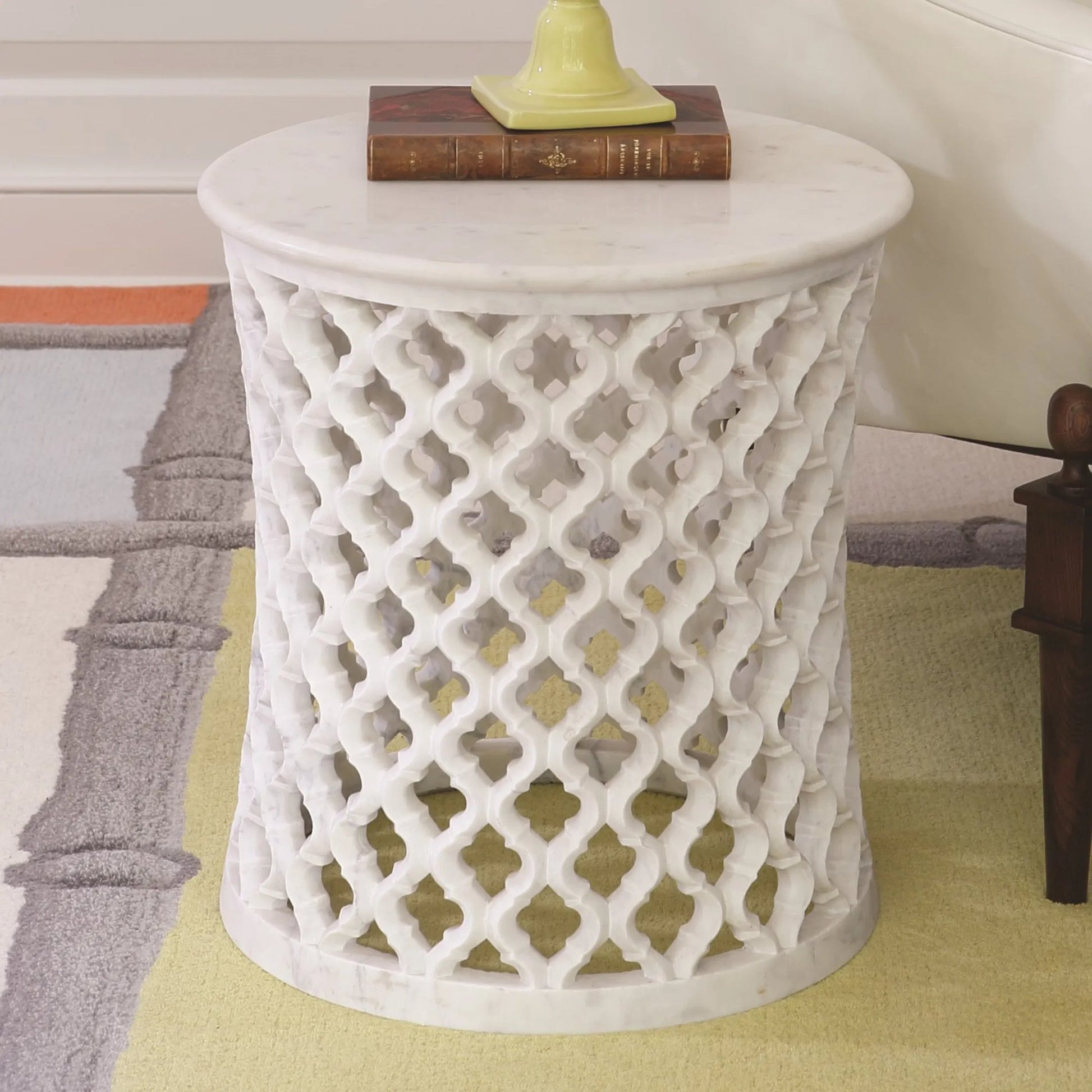 Arabesque Side Table by Global Views. Made from hand carved honed white marble in a transitional style.