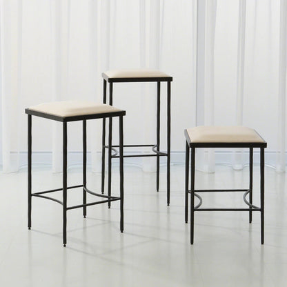 Hammered Bar Stool by Global Views. Made from iron in a modern style.