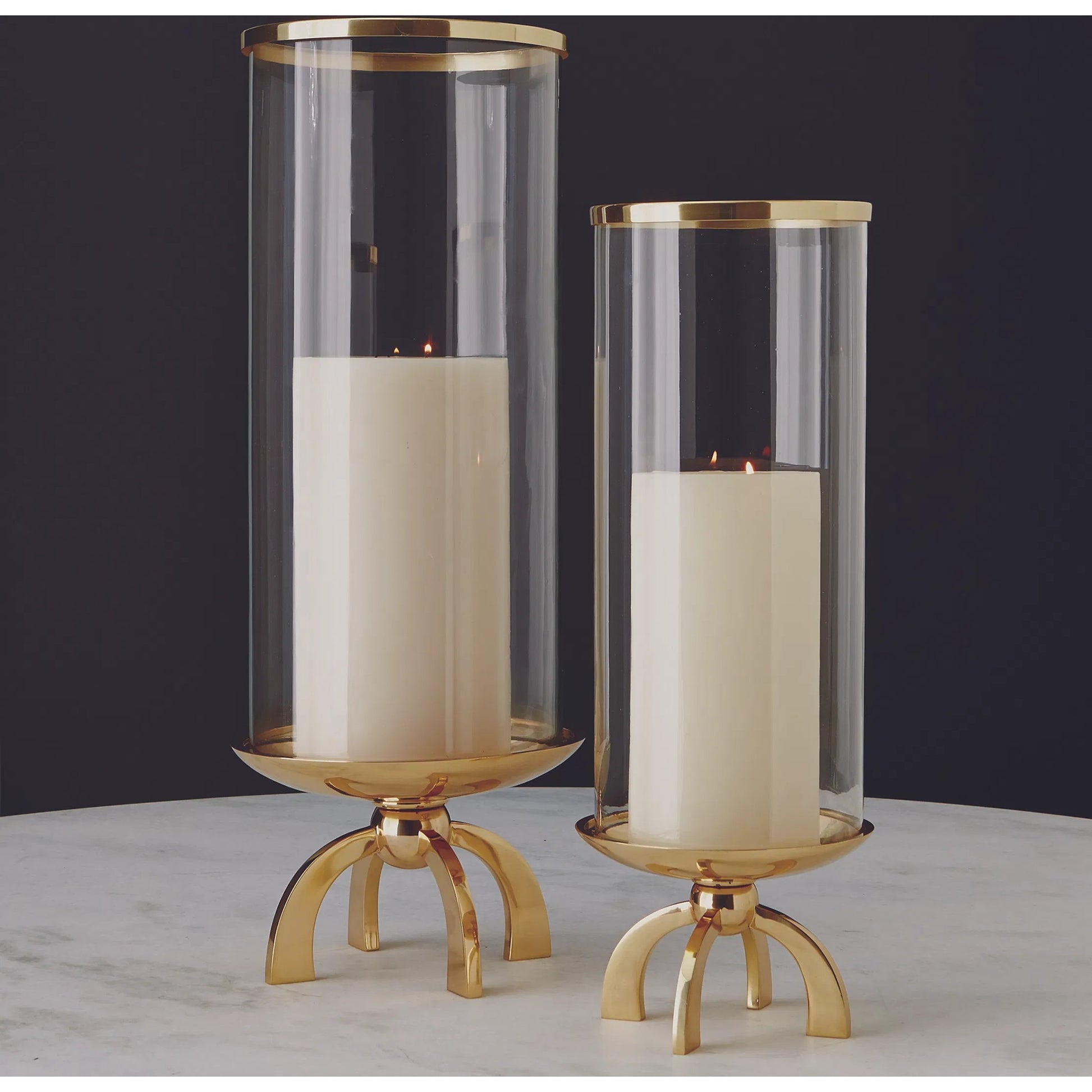 Quad Base Hurricane by Global Views in brass. Made from brass, glass in a transitional style.
