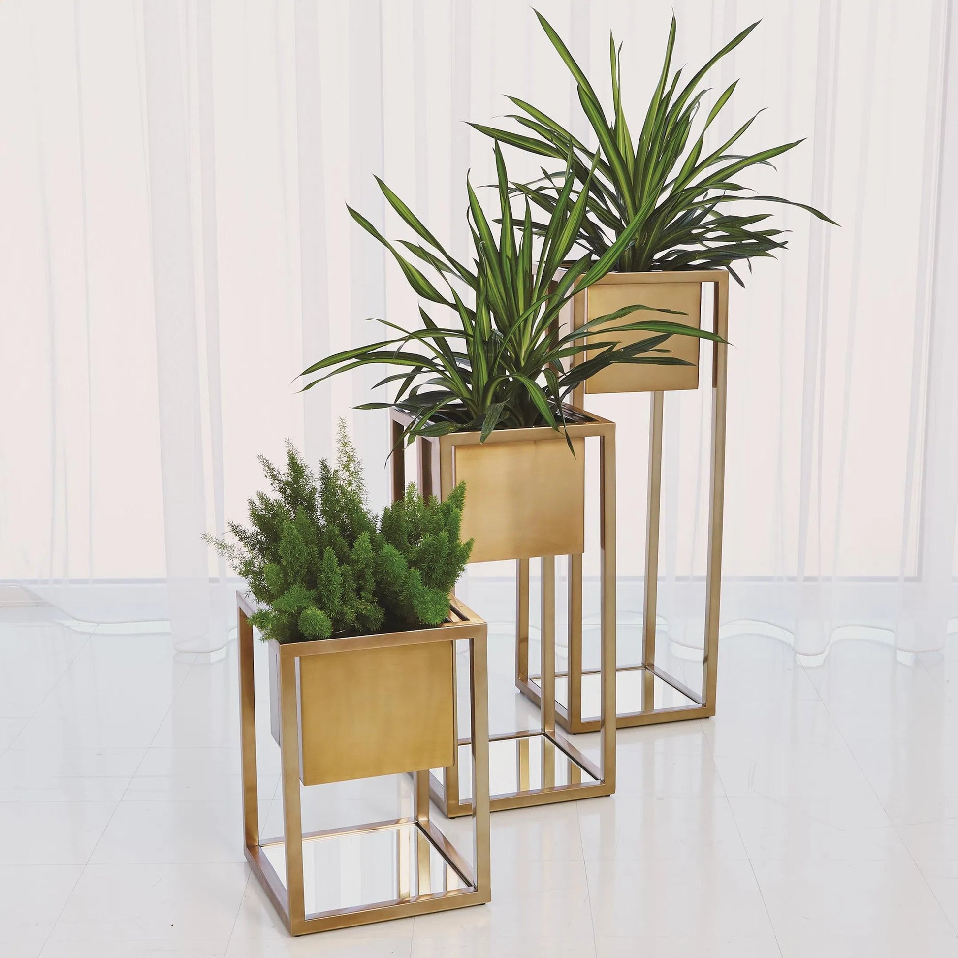 Escher Pedestal Planter by Global Views. Made from unique in a modern style.