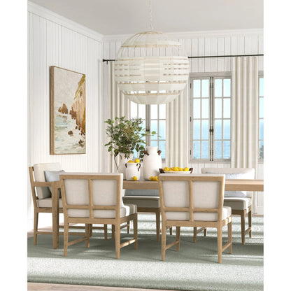 Lapsley Orb Chandelier by Currey and Company in vanilla, white. Made from wrought iron, kraft paper twine, frosted glass in a modern style.