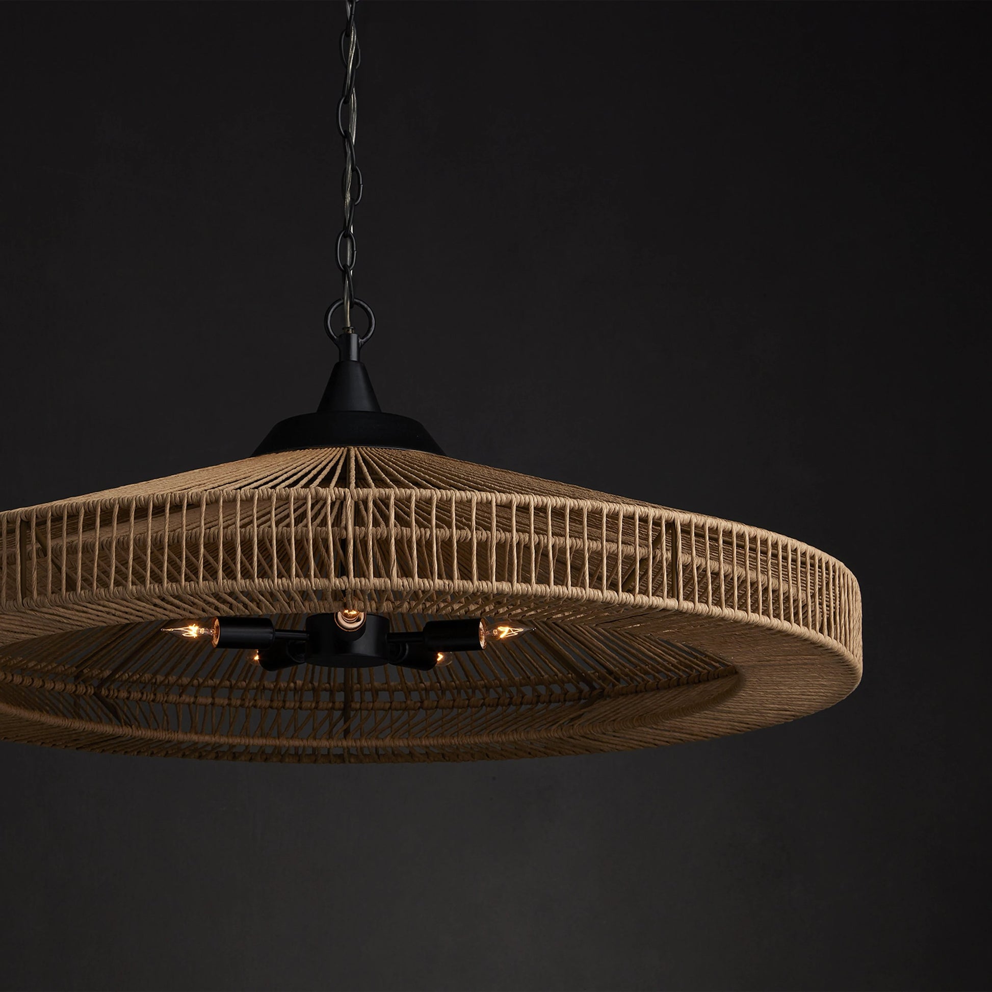 Maldives Chandelier by Currey and Company in natural, satin black. Made from wrought iron, kraft paper twine in a coastal style.