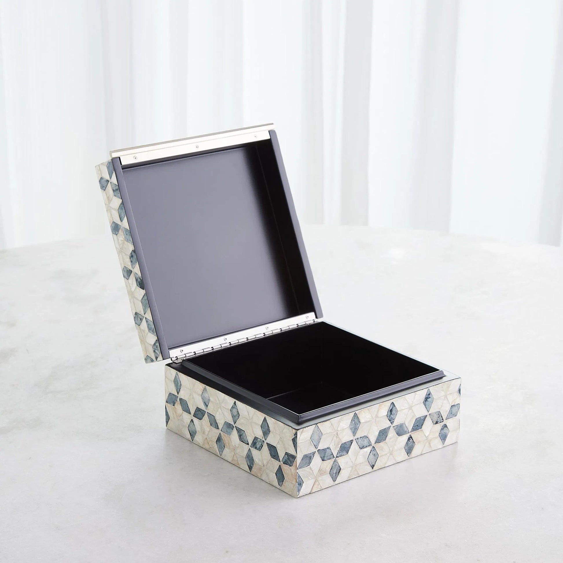 Capiz Shell Box by Global Views in nickel. Made from mdf, stainless steel, capiz shell, mother of pearl in a eclectic & global style.