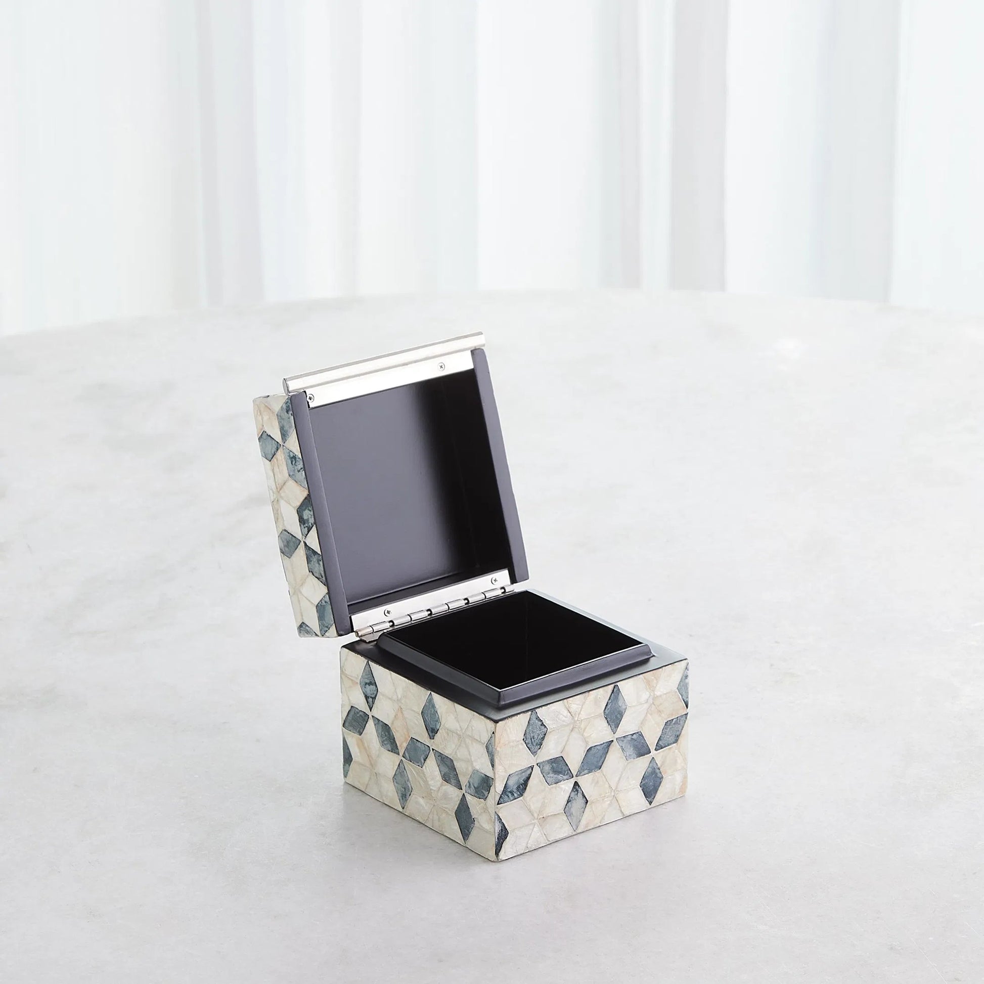 Capiz Shell Box by Global Views in nickel. Made from mdf, stainless steel, capiz shell, mother of pearl in a eclectic & global style.