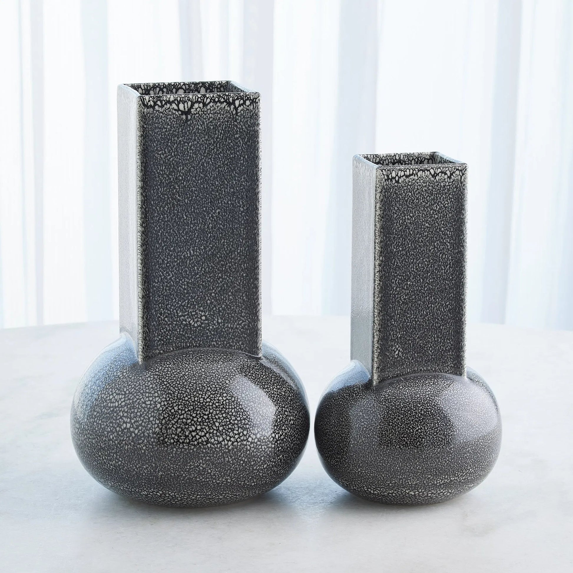 Crocus Vase by Global Views. Made from earthenware in a modern style.