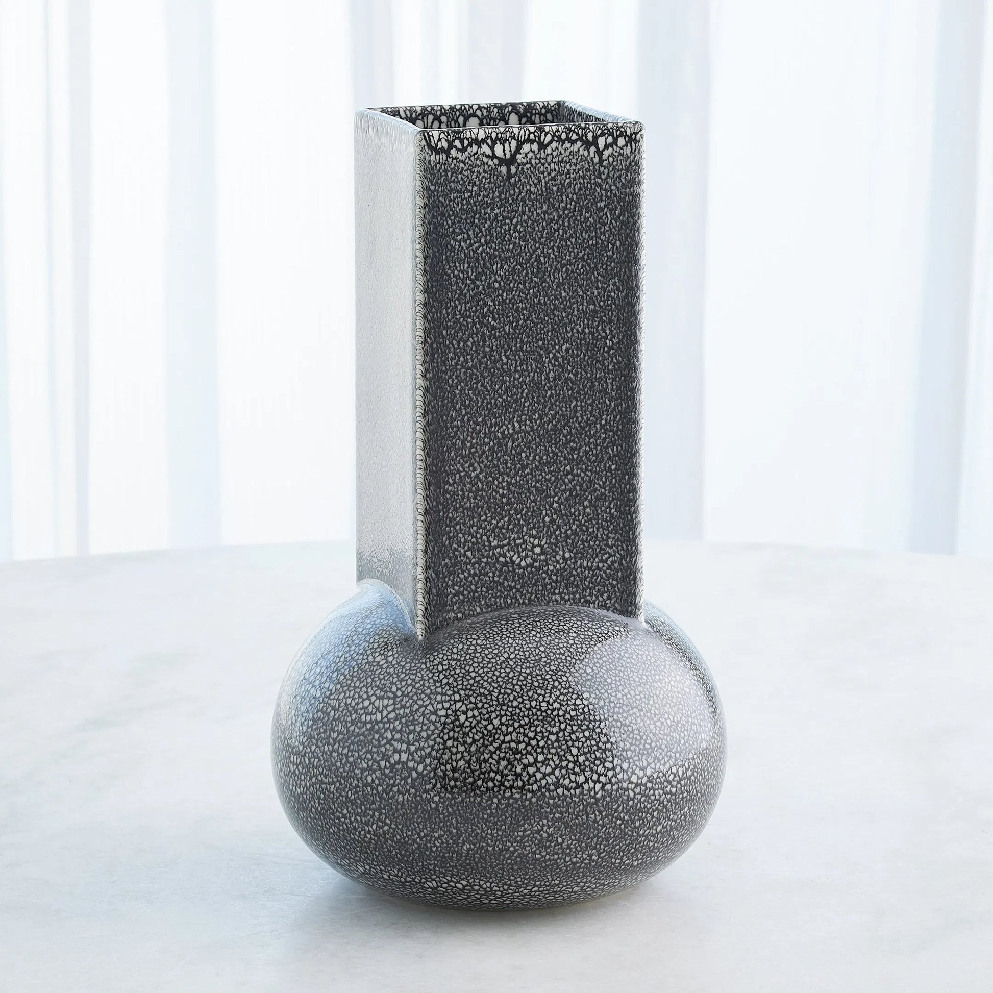 Crocus Vase by Global Views. Made from earthenware in a modern style.