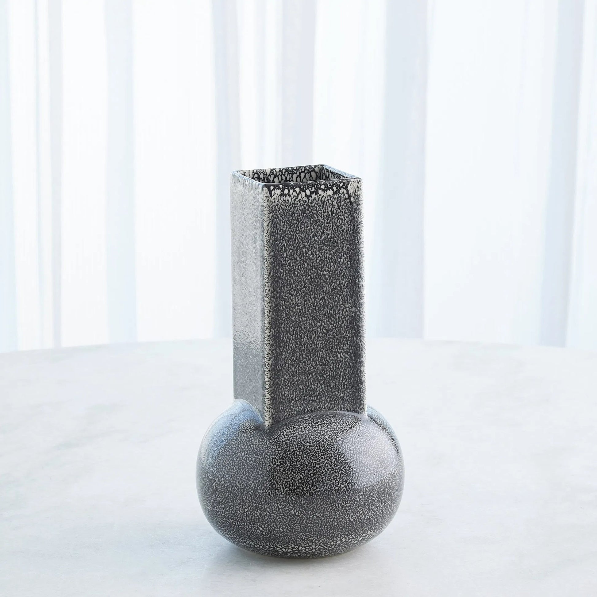 Crocus Vase by Global Views. Made from earthenware in a modern style.