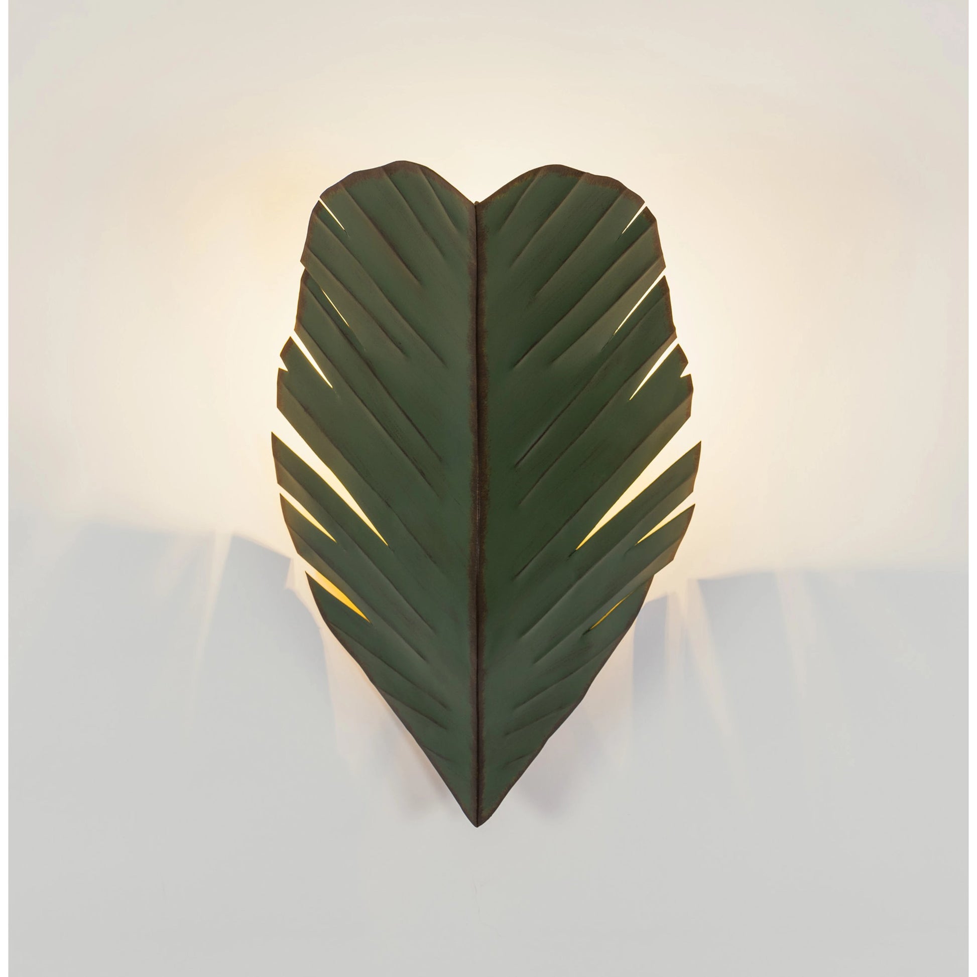 Sconce by Varaluz in banana leaf. Made from banana leaf, recycled steel in a coastal style.