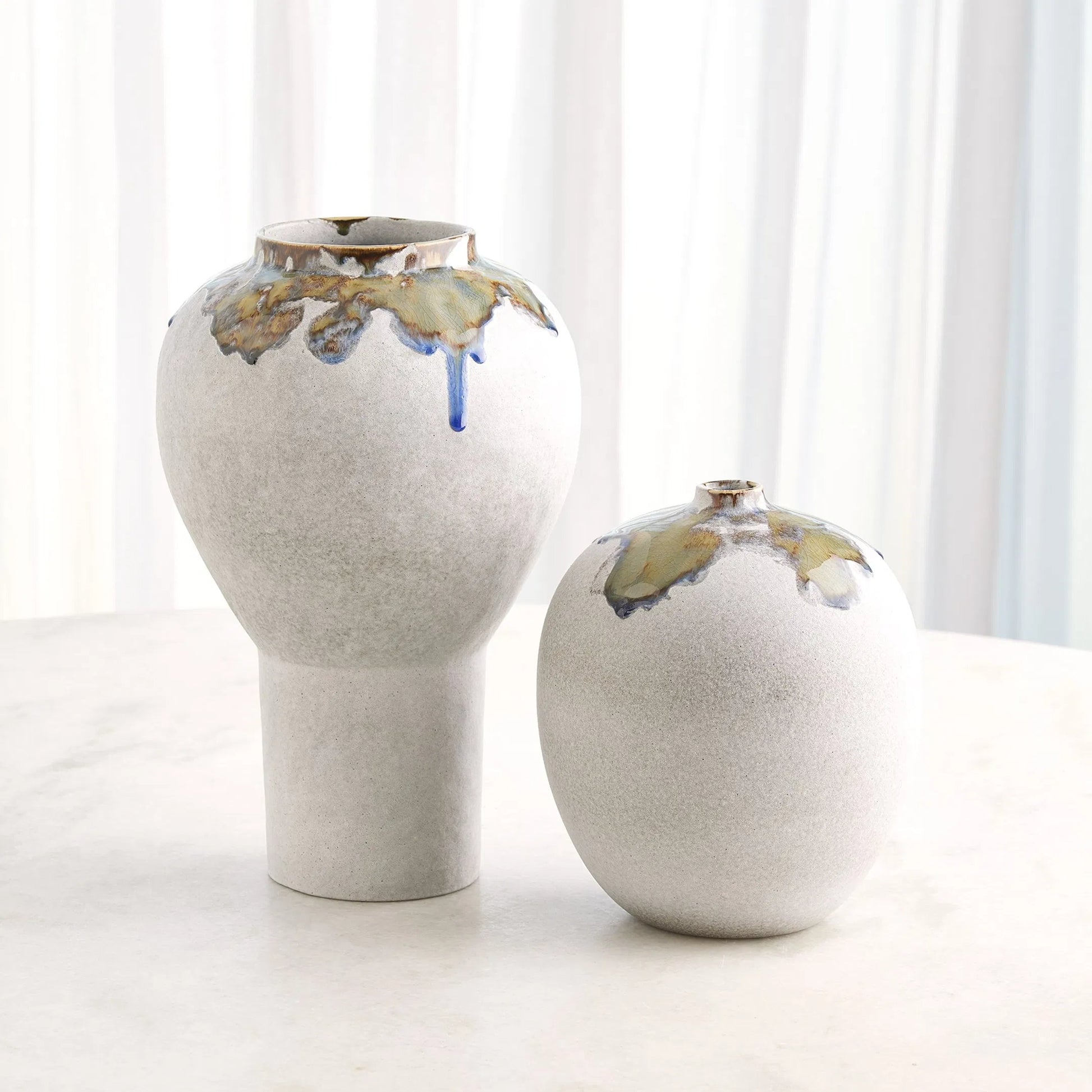 Volcan Footed Vase by Global Views in grey, reactive green. Made from ceramic in a eclectic & global style.
