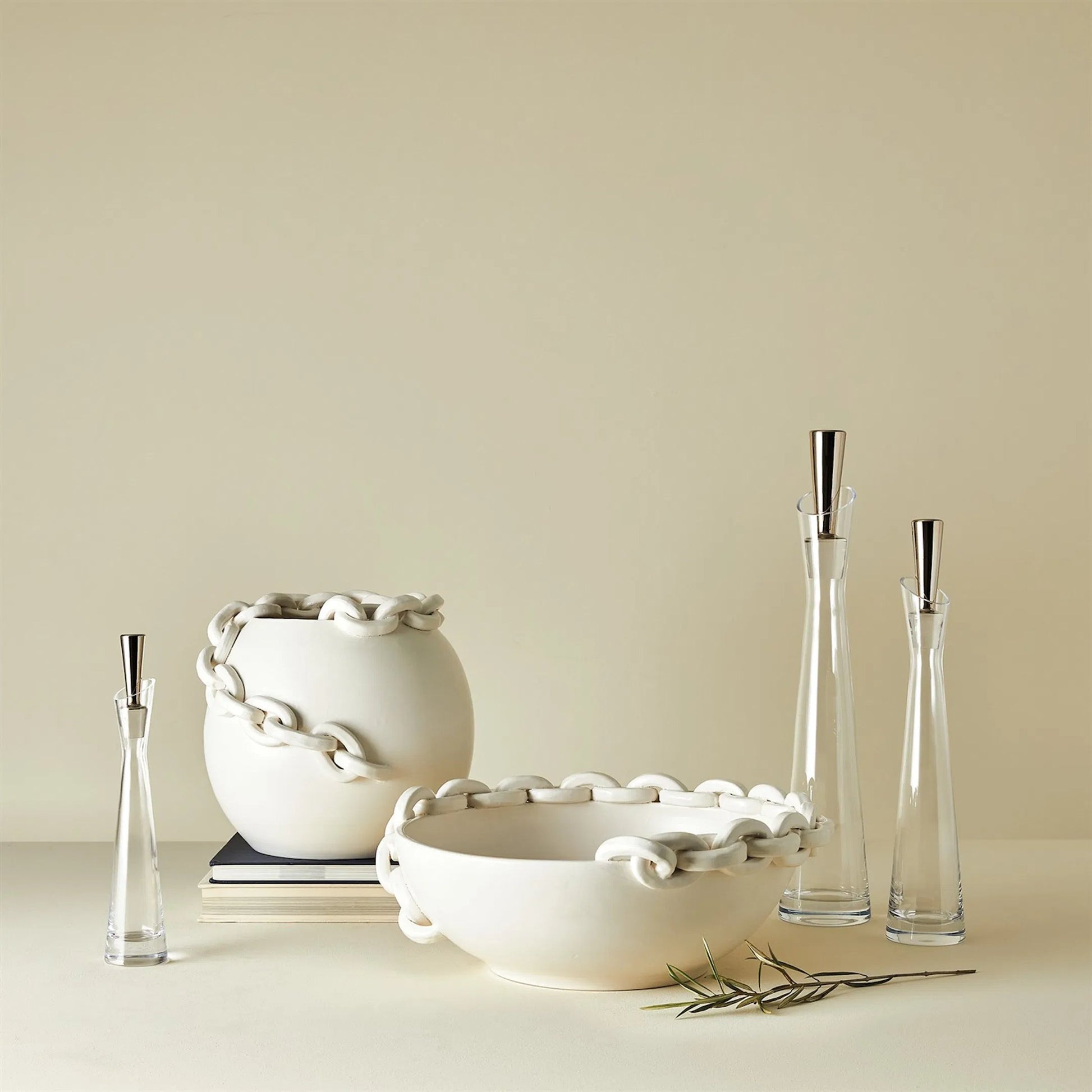 Slant Decanter by Global Views. Made from glass in a transitional style.
