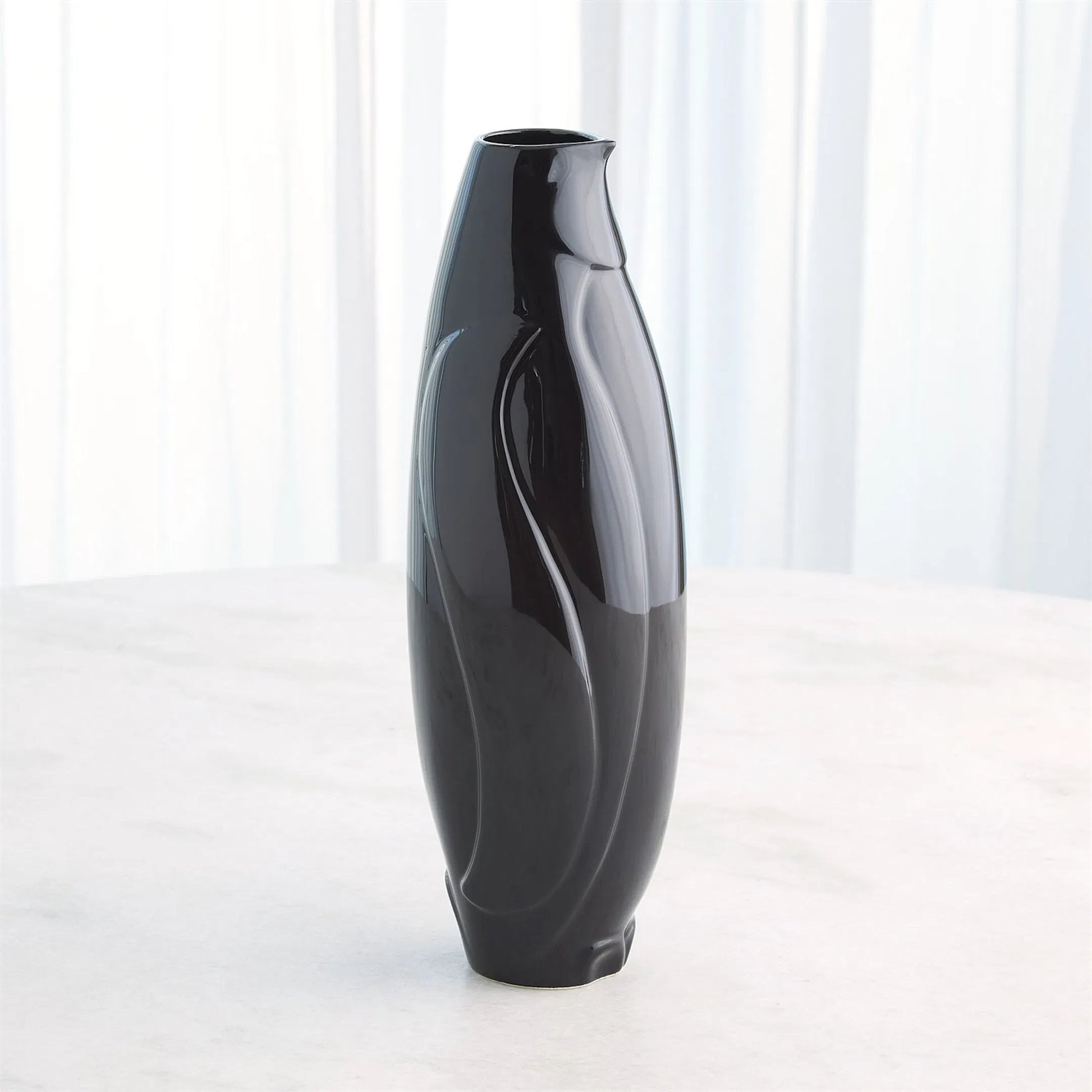 Penguin Vase by Global Views. Made from ceramic in a modern style.