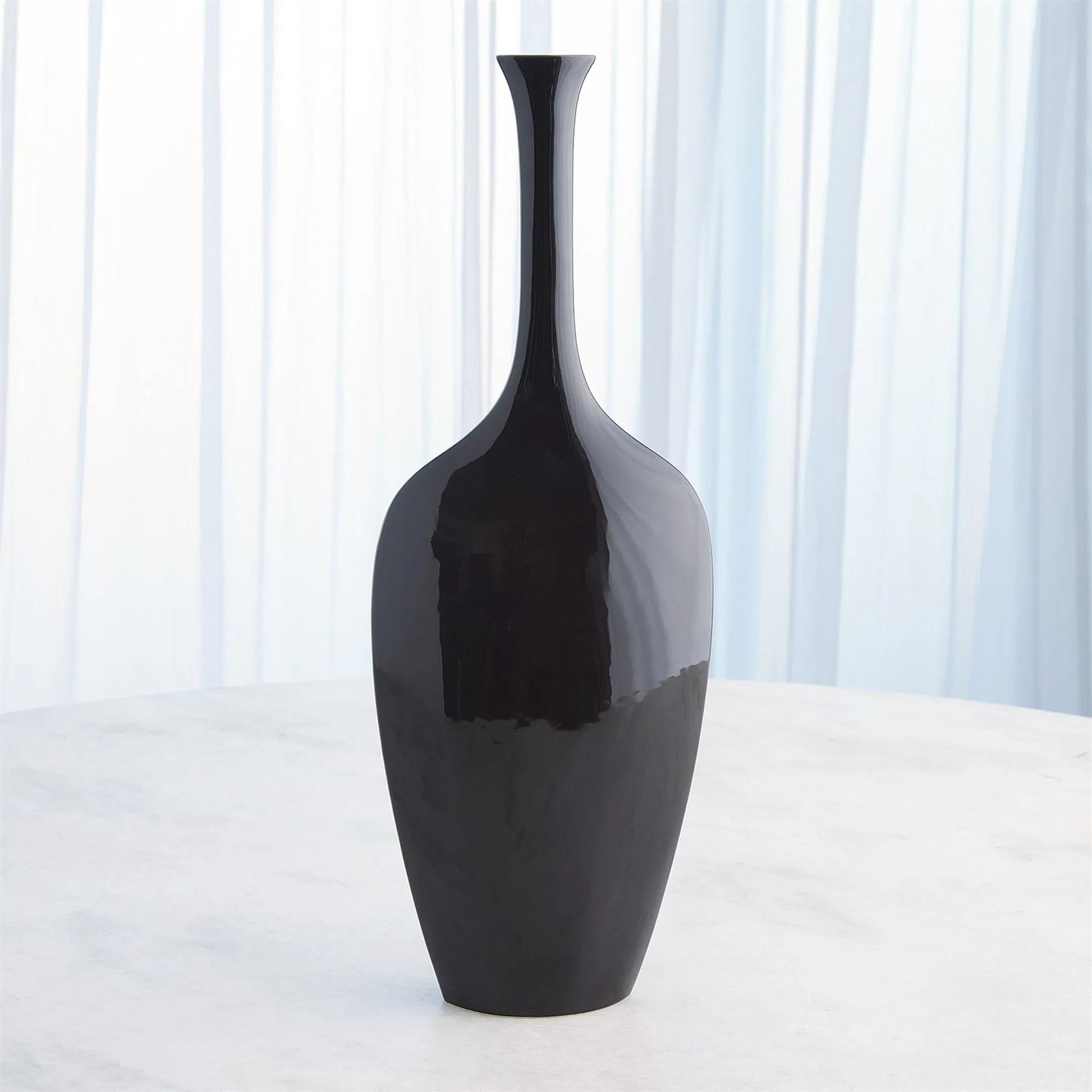 Silhouette Vase by Global Views. Made from ceramic in a modern style.