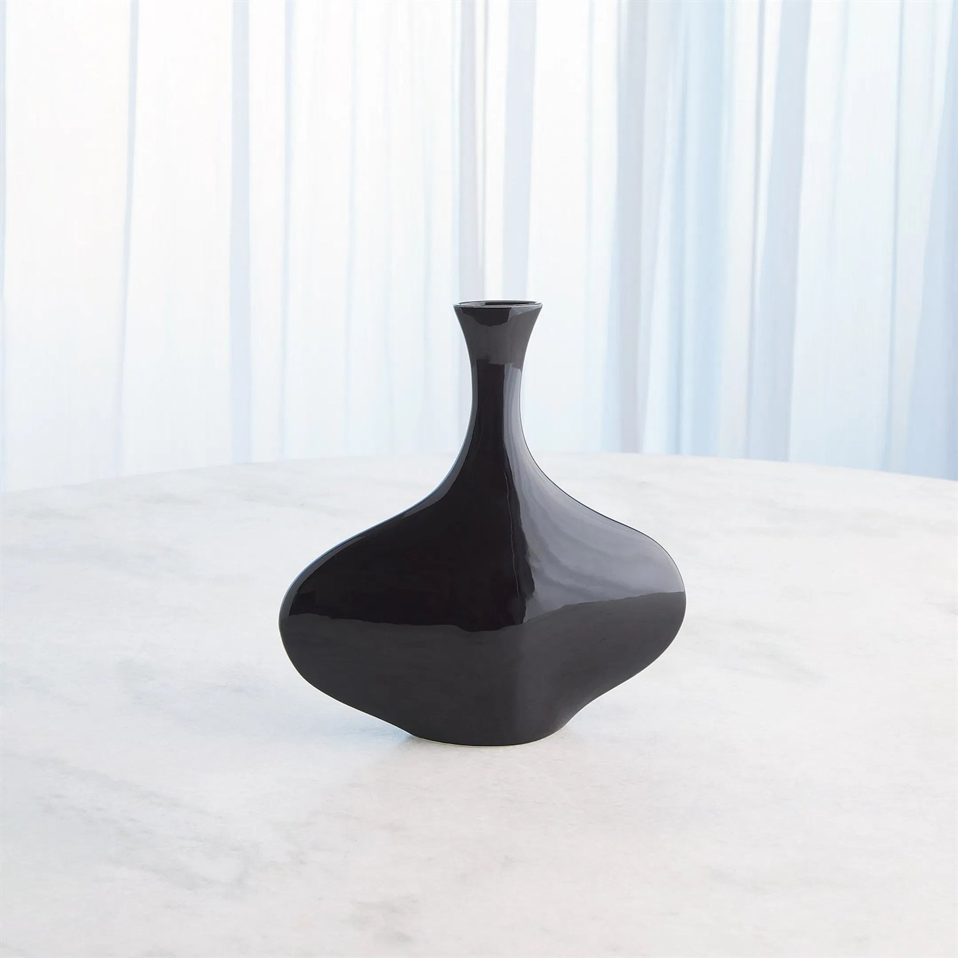 Silhouette Vase by Global Views. Made from ceramic in a modern style.