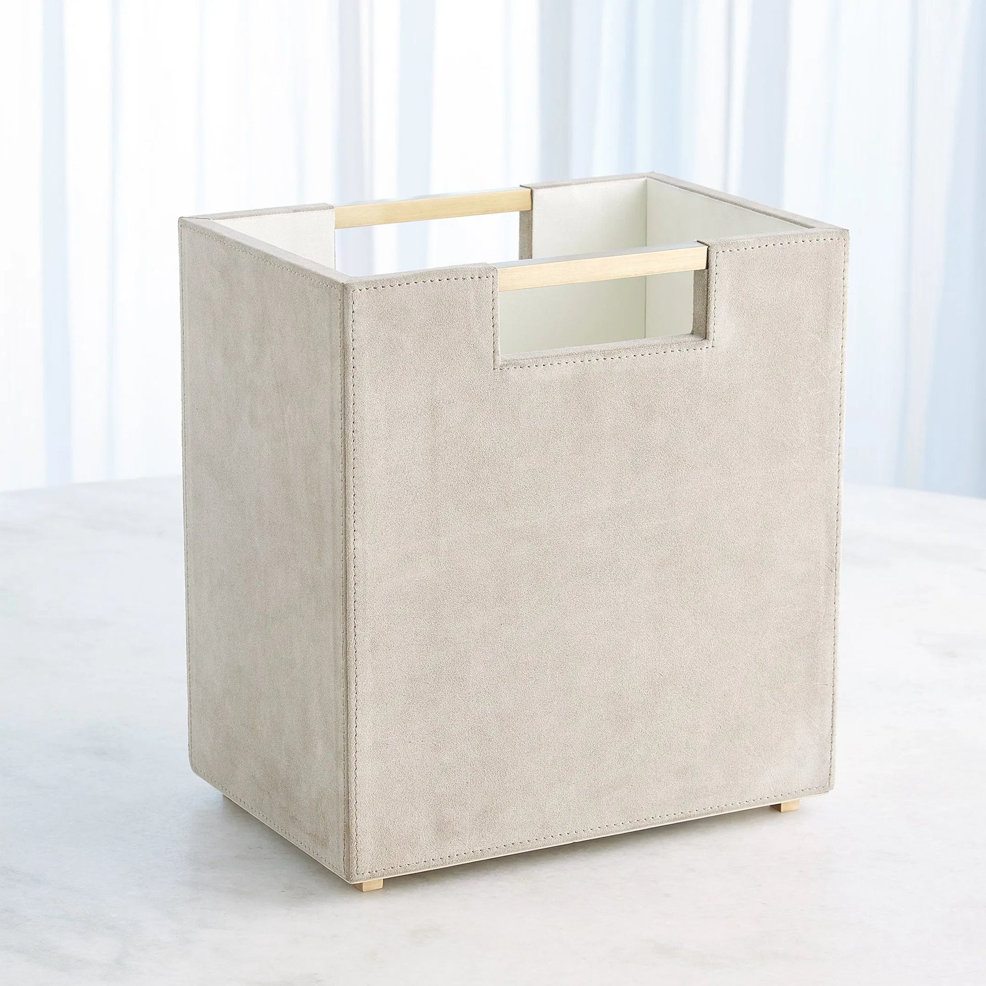Posh Wastebasket by Global Views. Made from mdf, cloth polysuede, brass in a unique style.