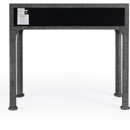 Chatham Raffia Console Table by Butler Specialty Company in charcoal and charcoal raffia. Made from gmelina beechwood solids, mdf panel with maple veneer, raffia, aluminium in a transitional style.