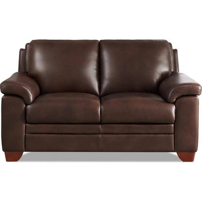 Magnum Loveseat by Hydeline in chestnut brown. Made from leather in a traditional style.
